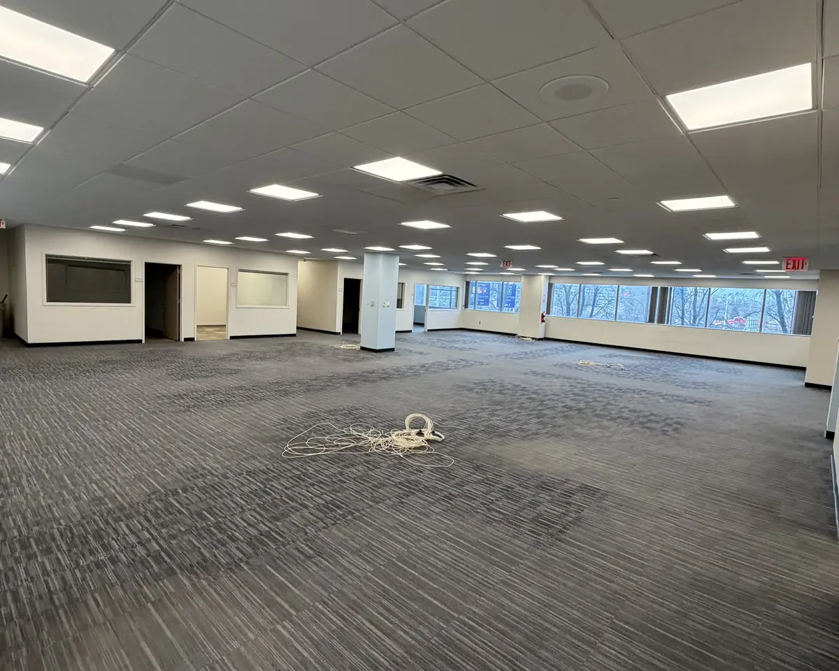 Empty, cleared open office floor after a commercial decommissioning by Premier Office Movers in New York City
